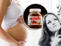 Pancia di donna incinta, barattolo di Nutella e punto interrogativo. La domanda è: si può mangiare la Nutella in gravidanza?
